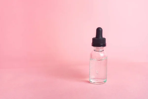 Concepto Una Botella Ácido Hialurónico Sin Inscripciones Sobre Fondo Rosa — Foto de Stock
