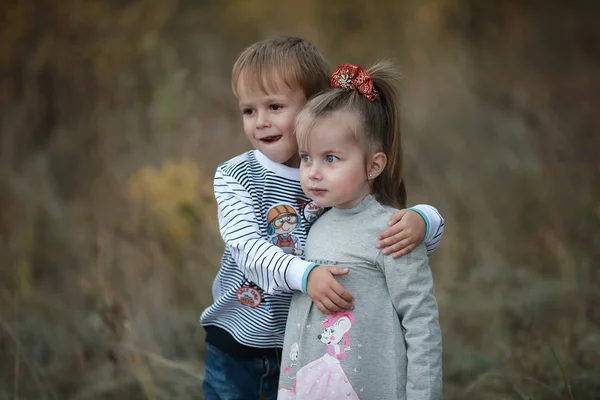 Boy embraces girl — Stock Photo, Image