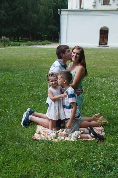 Happy Loving European Family Park Lawn Summer Husband Kisses His — Stock Photo, Image