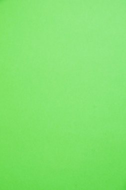 Kopya alanı olan bir arkaplan. Metin, dikey biçim için alanı olan renkli yeşil kağıt veya karton.