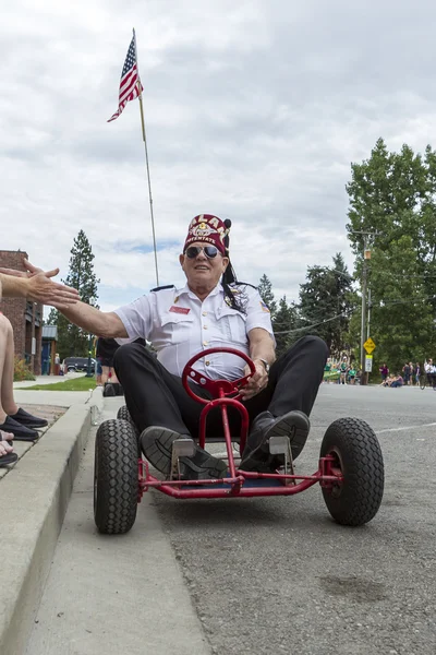 Shriner member drives go kart in parade. — Stock Photo, Image