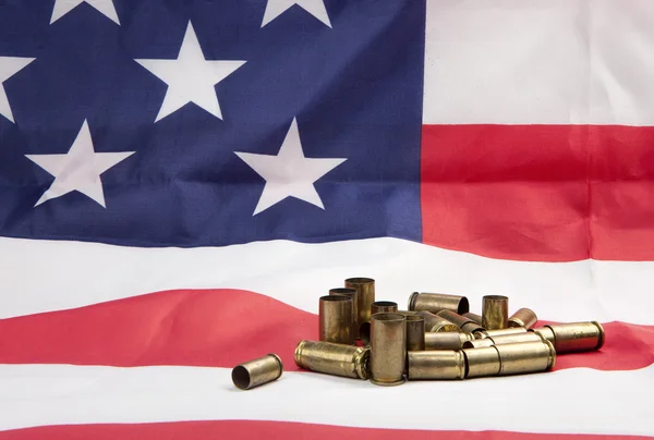 Pile of spent casings on the flag. — Stock Photo, Image