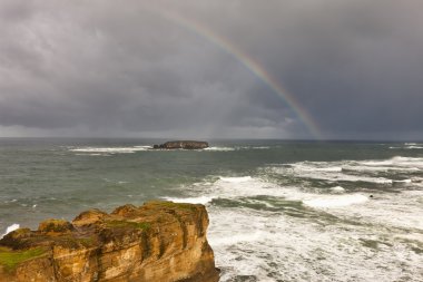 Rainbow over the Pacific. clipart