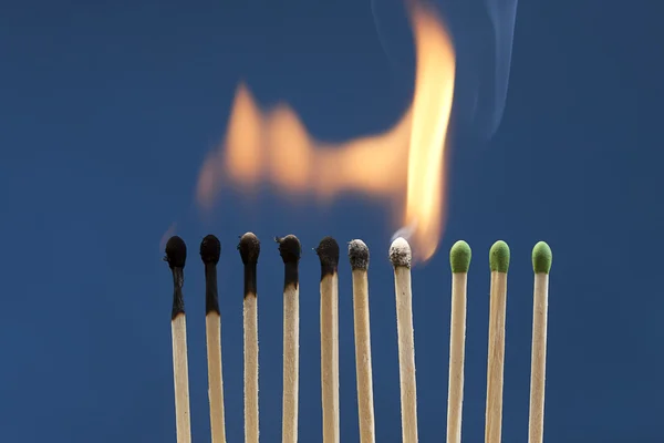 Matches lit in chain reaction. — Stock Photo, Image