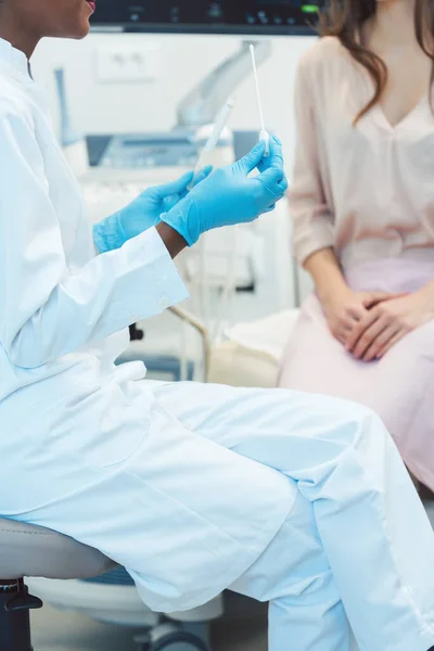 Gynecologist testing vaginal swab for STD — Stock Image Gynecologist testing vaginal swab for STD Stock Photo
