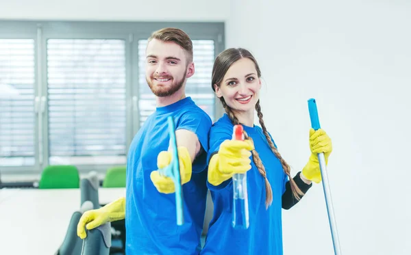 Woman and man in commercial cleaner team — Stock Photo, Image