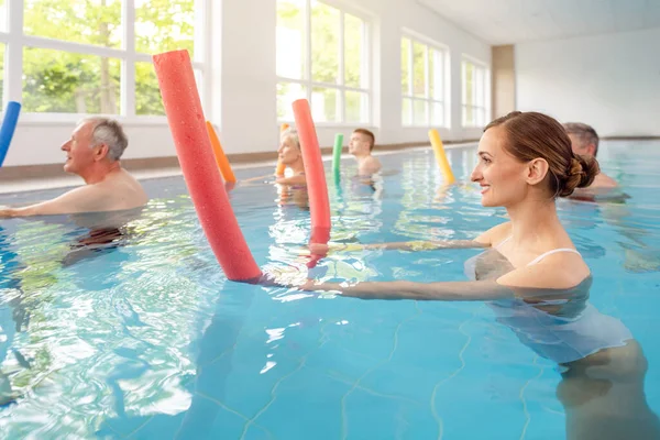 Patients during remobilization in a health center doing aquarobics — Stock Photo, Image