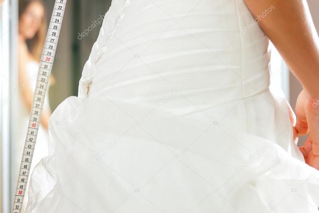 Bride At The Clothes Shop For Wedding Dresses Stock Photo