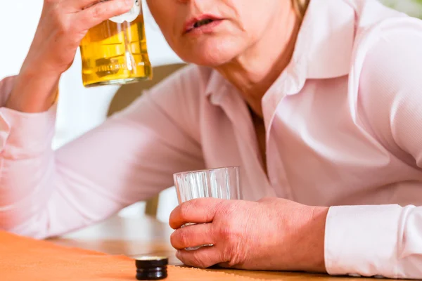 Female alcoholic drinking hard liquor — Stock Photo, Image