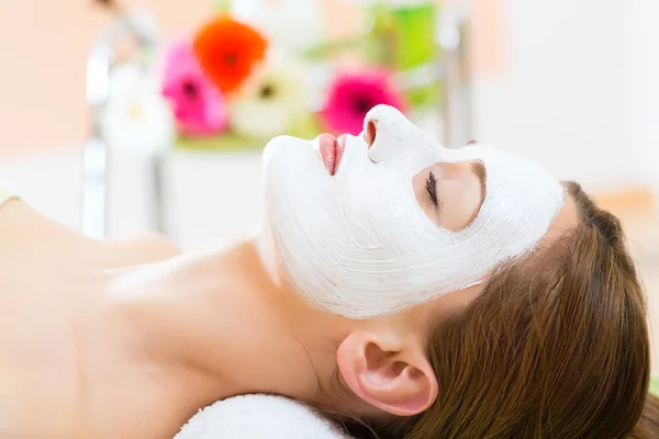 Woman getting face mask Stock Picture