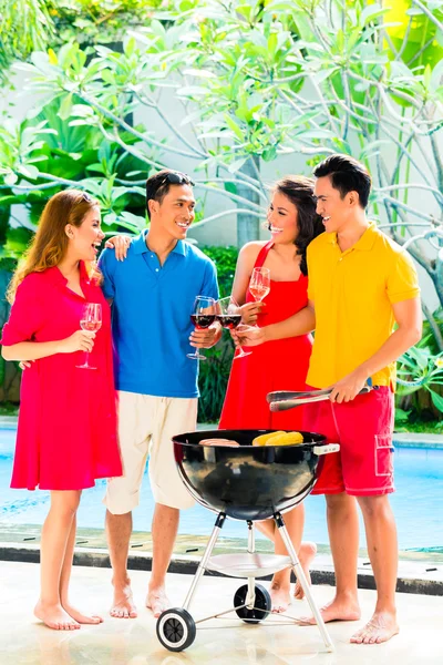 Asian couples having barbecue