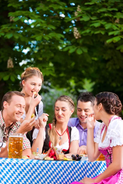 Friends on a table with beer — Stock Photo, Image