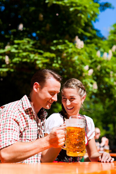 Happy Couple sitting in Beer garden