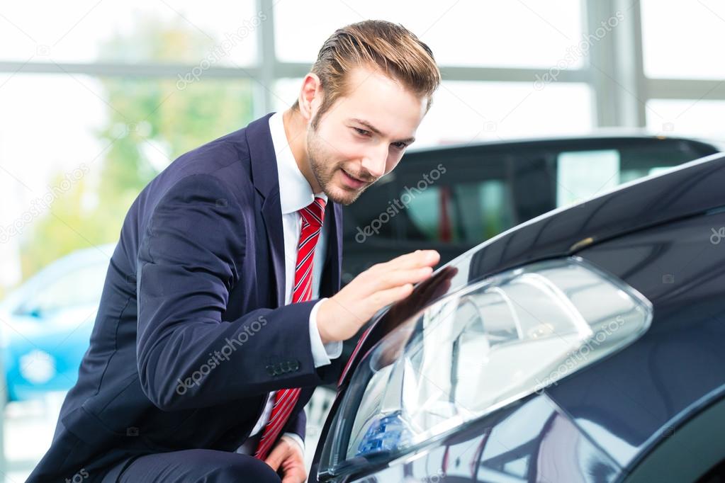 Auto dealer in car dealership