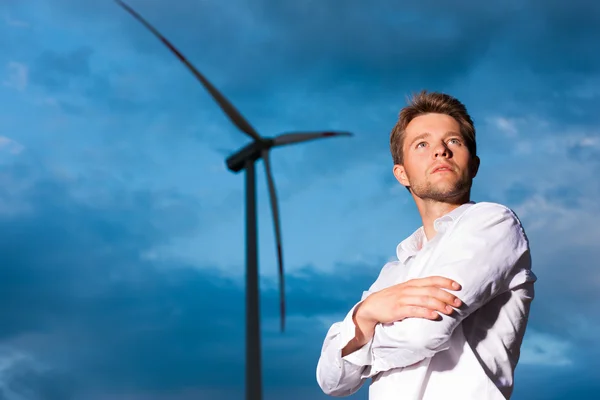 Man in front of windmill and sky — Stock Photo, Image