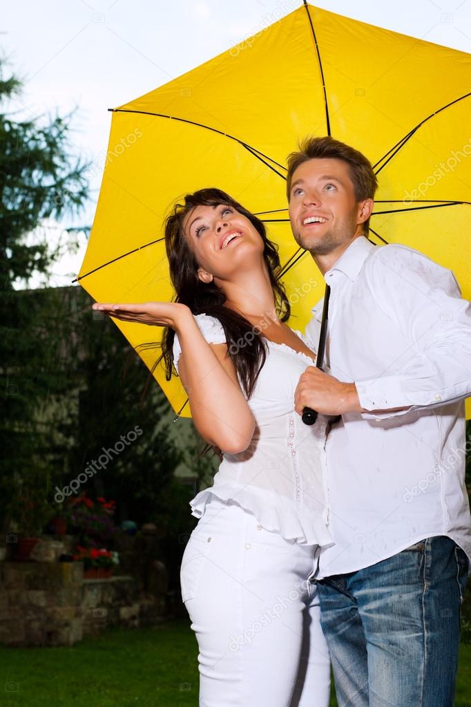 Happy couple with umbrella