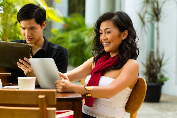 Asian people in cafe with tablet computers — Stock Photo, Image