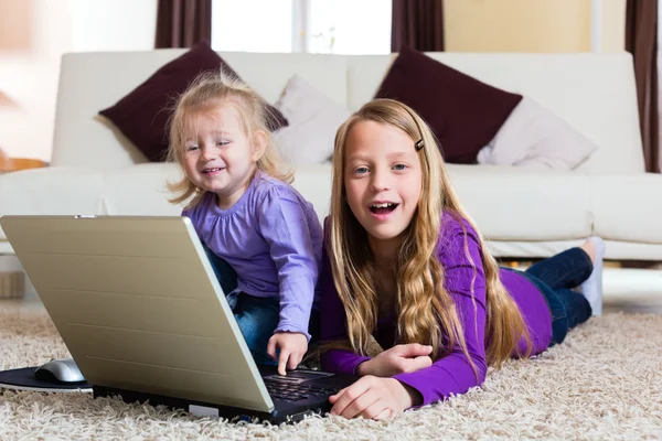 Family - child playing with the laptop — Stock Photo, Image