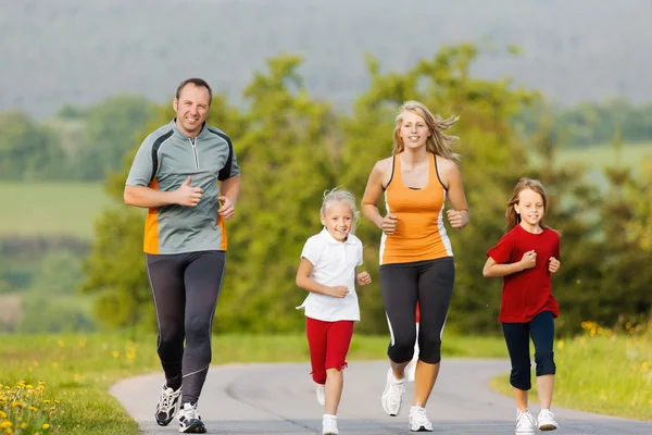 Family running for sport outdoors — Stock Photo, Image