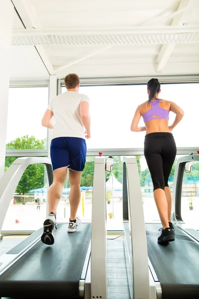 People in sport gym on treadmill running — Stock Photo, Image