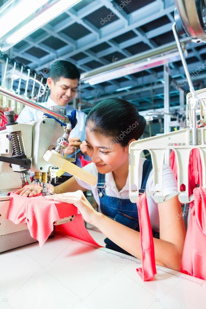 Indonesian Seamstress in Asian textile factory