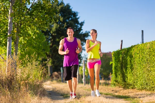 Man and woman running for sport — Stock Photo, Image