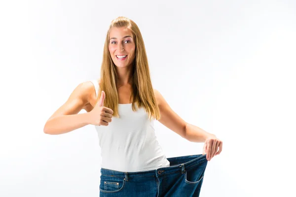 Kadın büyük pantolonlu - kilo verme — Stok fotoğraf