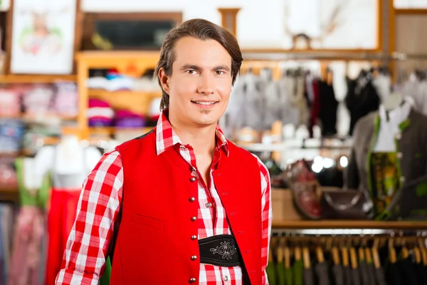 Man is trying Tracht or Lederhosen in a shop — Stock Photo, Image