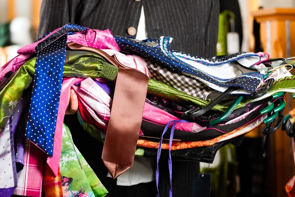 Man is buying Tracht or dirndl in a shop — Stock Photo, Image