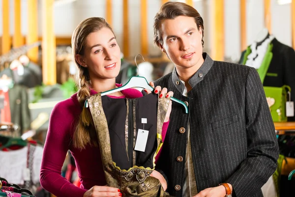 Couple is buying Tracht or dirndl in a shop — Stock Photo, Image