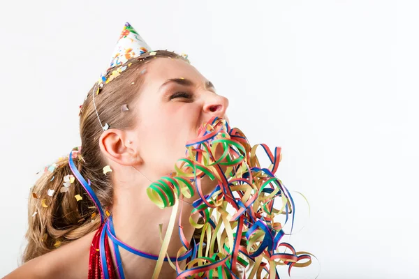 Woman at party with streamer — Stock Photo, Image