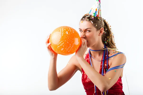 Angry Woman celebrating birthday with balloon — Stock Photo, Image