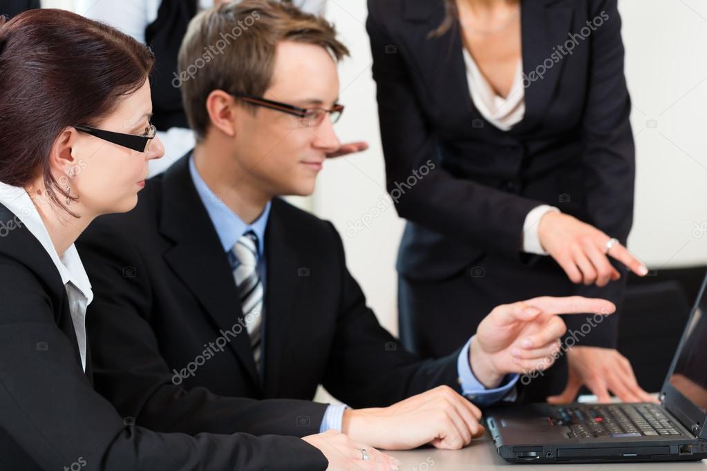 businesspeople have team meeting in an office