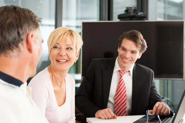 Mature couple with financial consultant — Stock Photo, Image