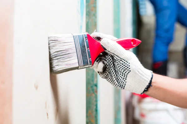 Painter with brush and paint — Stock Photo, Image