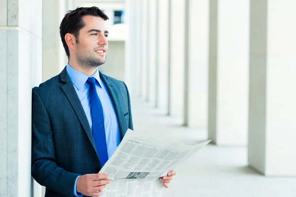 Businessman reading  business newspaper — Stock Photo, Image