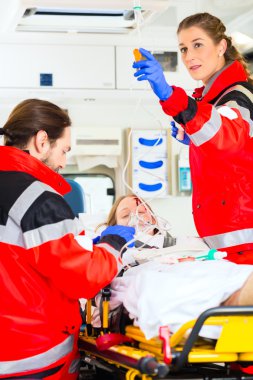Ambulance helping injured woman with infusion clipart