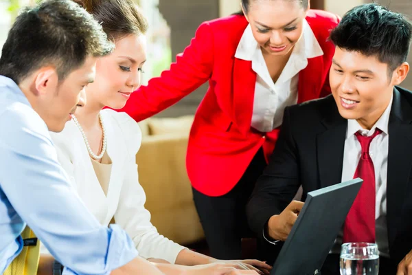 business people meeting in hotel lobby