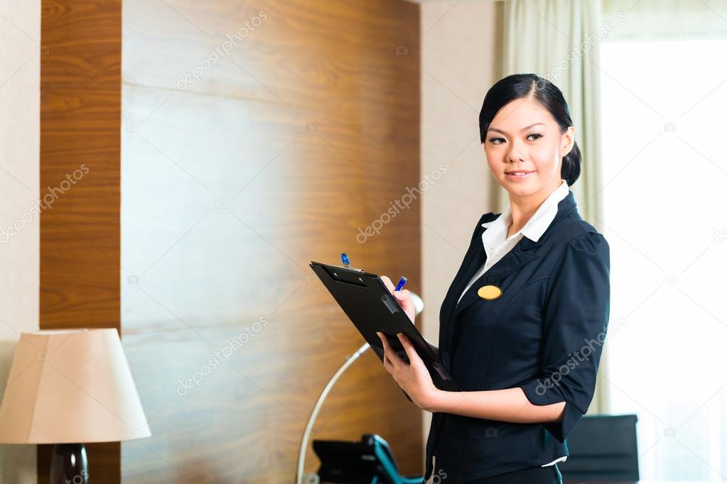 executive housekeeper controlling hotel room