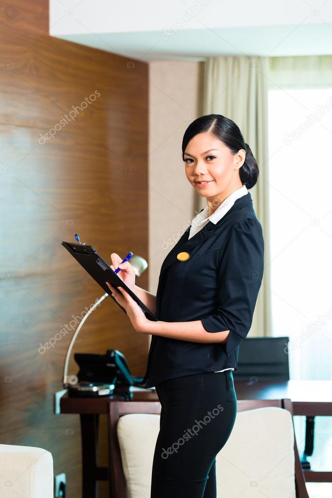 executive housekeeper controlling hotel room