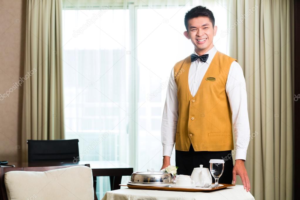 room service waiter serving food in hotel