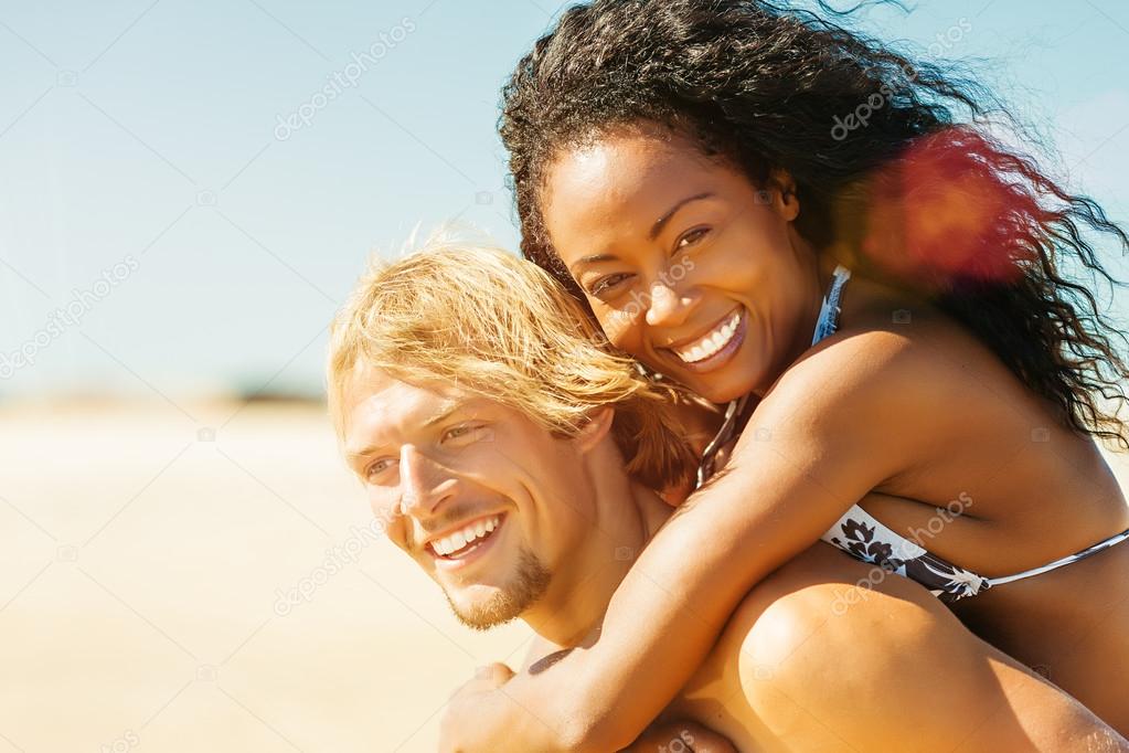 Couple on sunny beach in summer in vacation