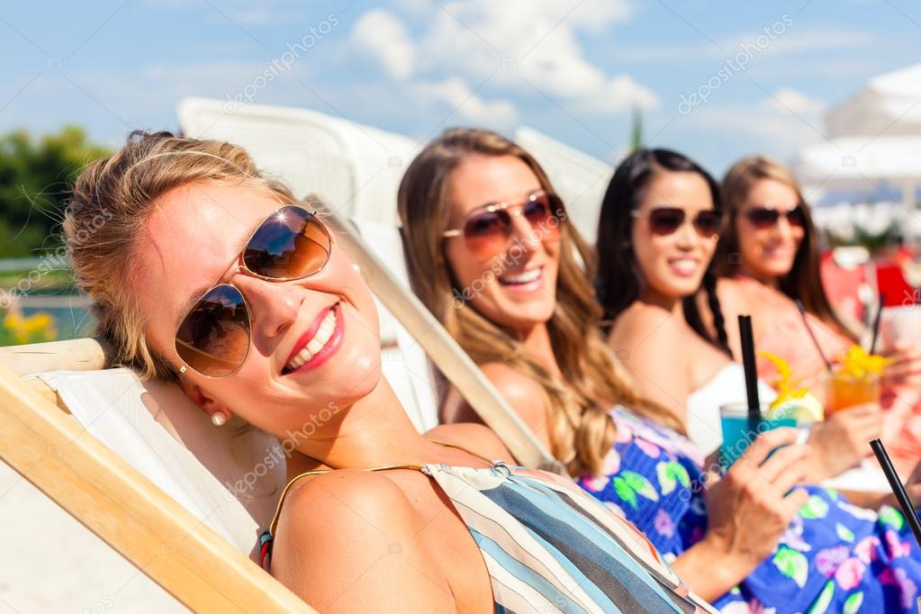Friends tanning in beach bar