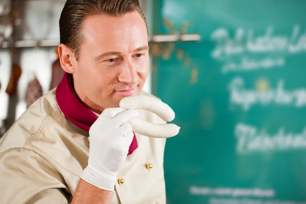 Butcher Smelling Fresh Sausages — Stock Photo, Image