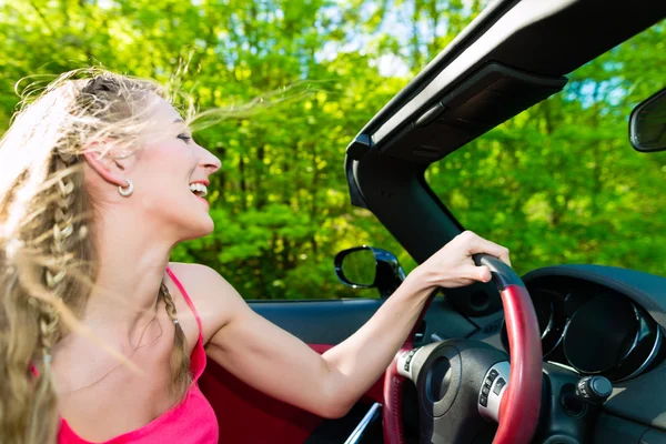Young woman with cabriolet in summer on day trip — Stock Photo, Image