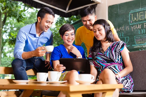 Young people in an Asian coffee shop — Stock Photo, Image
