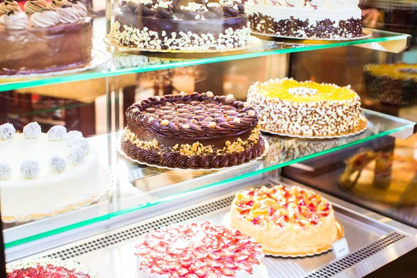 Pastry shop in glass cabinet display — Stock Photo, Image