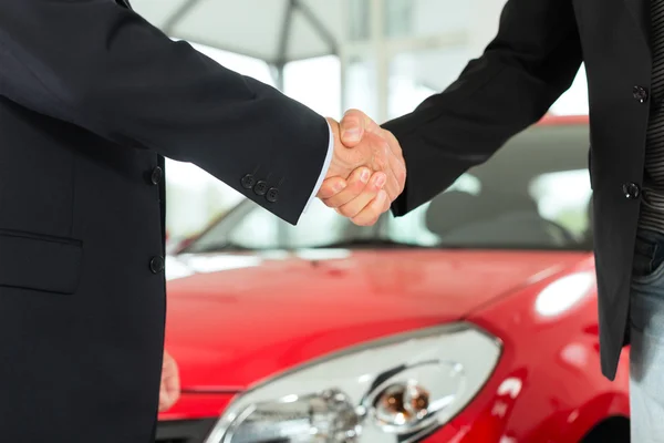 Handshake of two men in suits — Stock Photo, Image