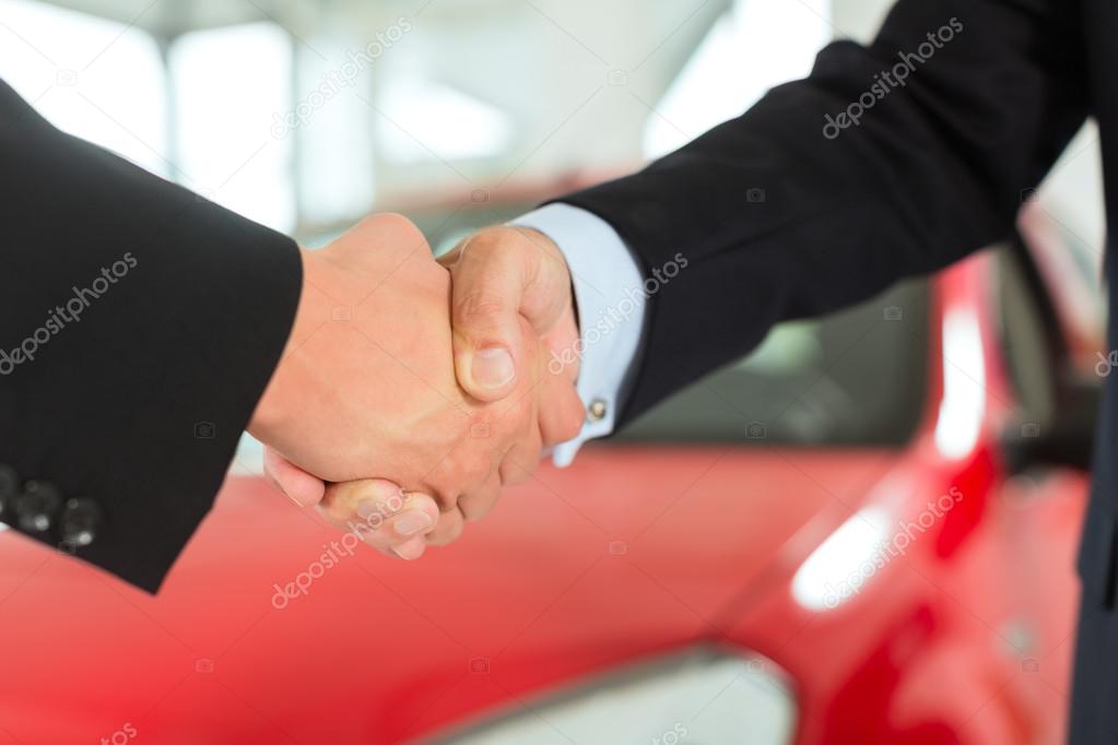 Handshake of two men in suits