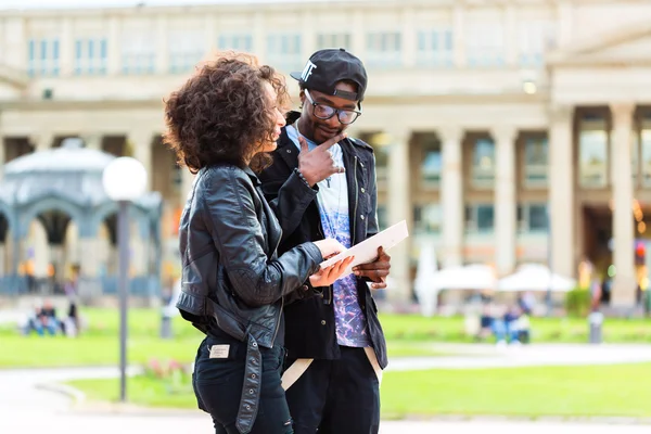 African couple doing sightseeing in city — Stock Photo, Image